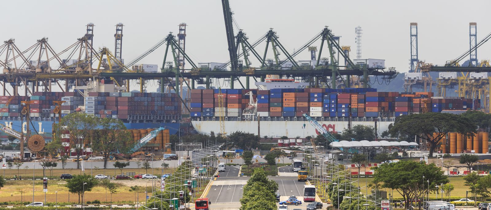 Container terminal with stacked containers and cranes